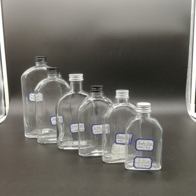 Serie de botellas de vidrio de tapa de tornillo de bebida plana de 100ml a 500ml