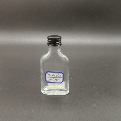 Botella de licor pequeña plana de 50 ml