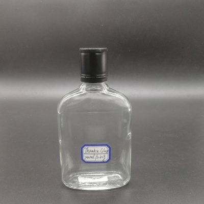 Botella de vidrio de ron plano de tapa ROPP de 200 ml