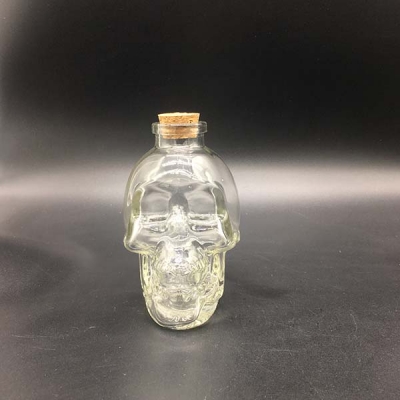 Botella de forma de cráneo tipo corcho de madera