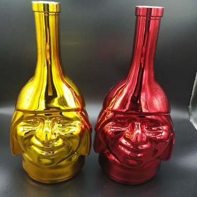 Electroplacado oro rojo cara forma botella de vidrio
